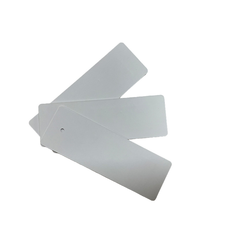 Paper clothing hang tag with embedded RFID chip and antenna